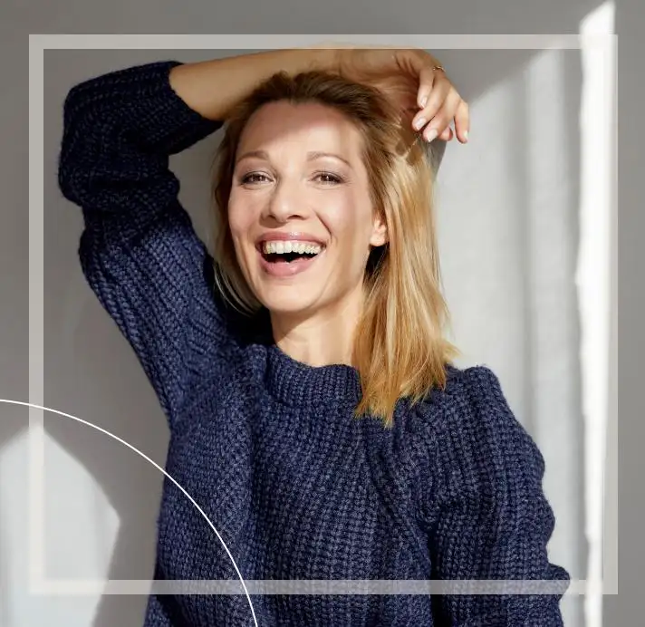 woman happy hand on head