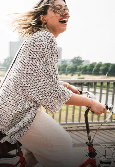 happy lady riding bike